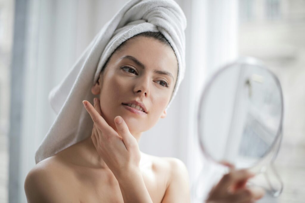 pexels-photo-3764013-3764013 A serene and elegant woman enjoys a skincare ritual, enhancing her natural beauty in the comfort of her home.